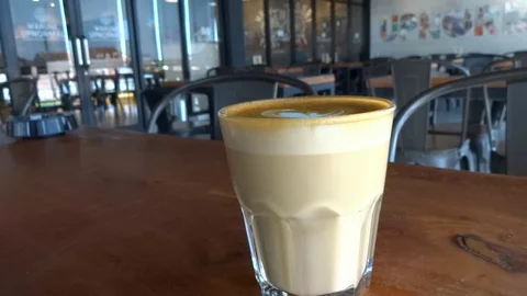 My coffee drink while im at upnormal cafe in bogor city, west java, Stock Footage 117024320