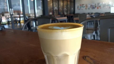 My coffee drink while im at upnormal cafe in bogor city, west java, Stock Footage 117024324