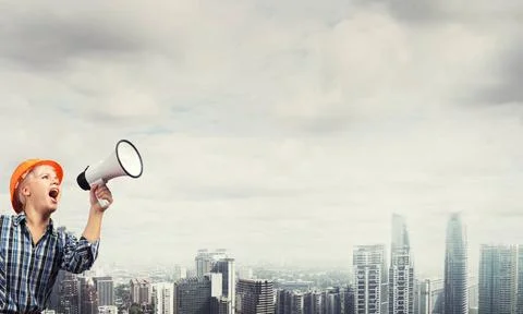My development plan Engineer woman with megaphone on modern city landscape... Stock Photos
