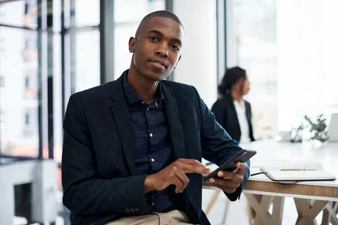 My favourite operational efficiency tool. a young businessman using a smartphone Stock Photos
