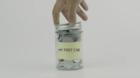 My First Car text or word on yellow sticky notes attached to a coin jar Stock Footage 307158509
