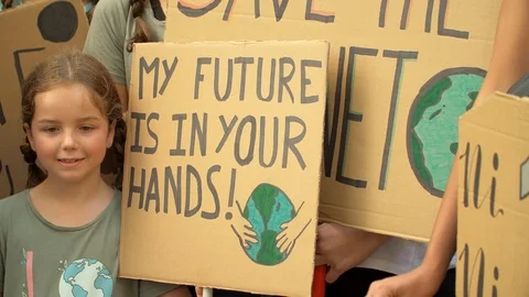 My future is in your hands. Young Girl and Posters at Global Climate Strike.  Video stock 116796659