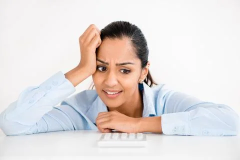 My head might explode. Shot of a young businesswoman looking stressed. Foto stock