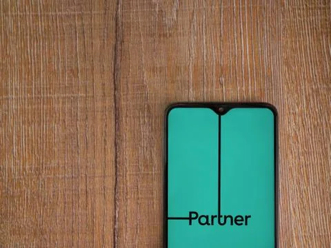 My Partner app launch screen with logo on the display of a black mobile smart Stock Photos