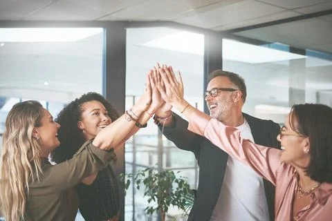 My team is capable of everything. a diverse group of businesspeople giving each Stock Photos