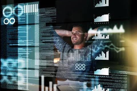 My work here is done. Shot of a smiling computer programmer working at his co 스톡 사진