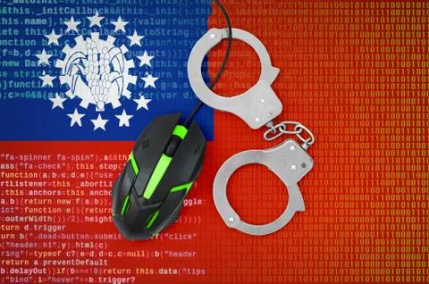 Myanmar flag  and handcuffed computer mouse. Combating computer crime, hacker Stock-Fotos