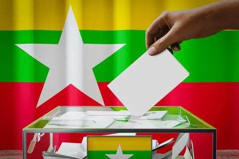 Myanmar flag, hand dropping ballot card into a box - voting, election concept Ilustración de archivo