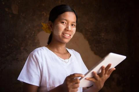 Myanmar girl using tablet computer Stock Photos