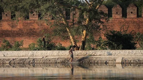 Myanmar soldier bathing in lake Stock Footage 102640862