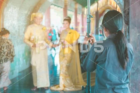 Myanmar wedding photography. A Burmese couple in a tradition dress that was p Stock Photos