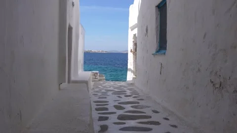 Mykonos Greece Low Side Angle Alley with Painted Path and Walls Leading to .. Stock Footage 336512973