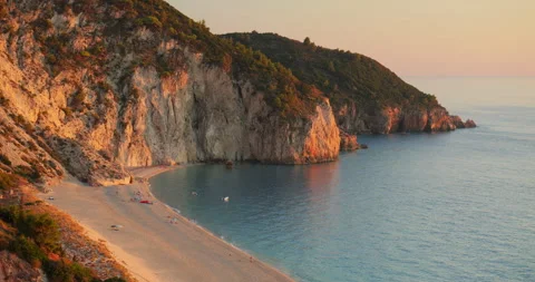 Mylos beach cliffs lit by the warm light of sunset, Lefkada island, Greece Stock Footage 298917248
