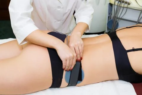 Myostimulation of the mouse on the buttocks. Stock Photos