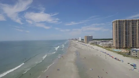Myrtle Beach summer flying drone down beach Stock Footage 127518079