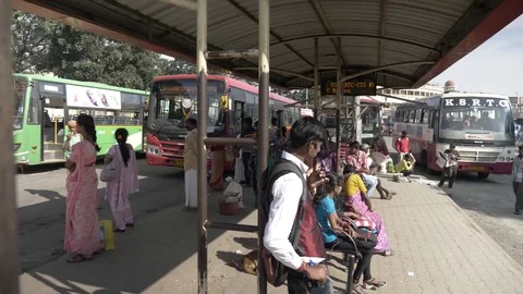 MYSORE, India - passengers wait at the City Bus Stand Stock-Footage 84169532