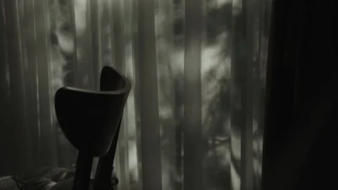 Mysterious and Intriguing Shadows That Dance Gracefully Behind a Chair in a Stock Footage 294068854