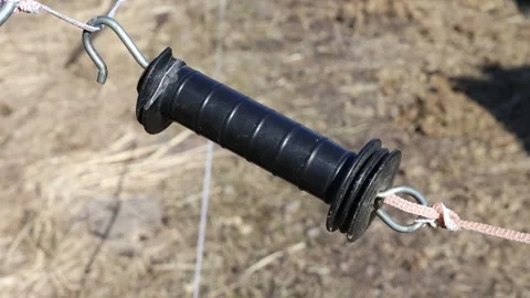 A mysterious black object suspended from a rope, perfect for use in scenes .. Stock Footage 332225389