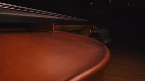 Mysterious close up macro shot of a violin. Slider shot down from the neck Stock-Footage 120819959