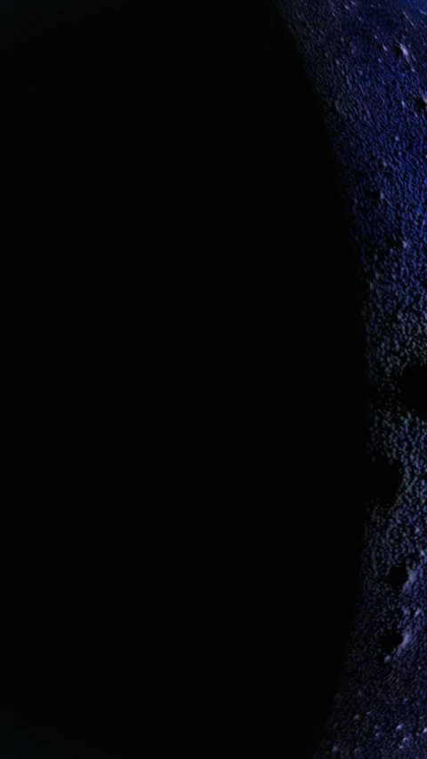 Mysterious dark planet with subtle blue rim light against a starry space ba.. Stock Footage 325908128