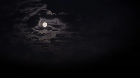 Mysterious full moon. Clouds cover the moon in the sky. Stock Footage 41606405