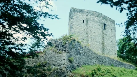 Mysterious gothic abandoned tower with branches waving at wind, static, Rec 709 Stock Footage 134901738