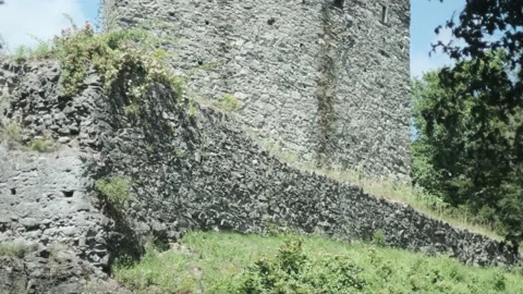 Mysterious gothic tower in windy day, medium shot, Tilt up, ungraded Stock Footage 135574593