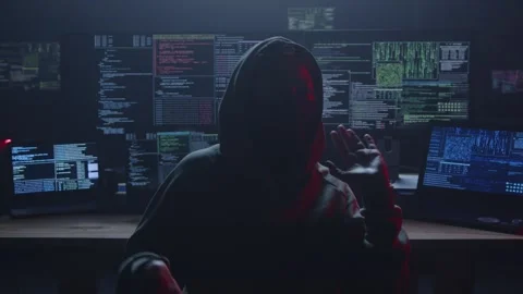 Mysterious Hacker in Dark Room Surrounded by Multiple Screens Stock Footage 281759888