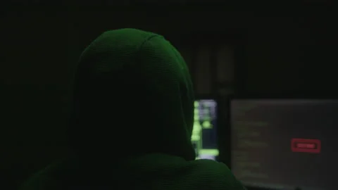 Mysterious Hacker or Programmer with Hoodie Hacking in a Desolate Room with.. Stock-Footage 234147984