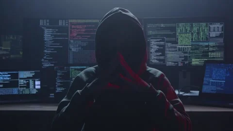 Mysterious Hacker Surrounded by Dark Environments and Several Screens Stock Footage 281759595
