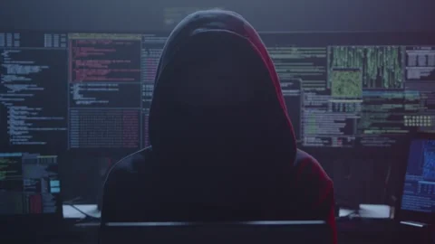 A Mysterious Hacker Working Stealthily in a Dimly Lit Control Room Stock Footage 281759630
