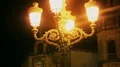 Mysterious haunted royal palace lit by yellow street lamps at night, history HD Footage