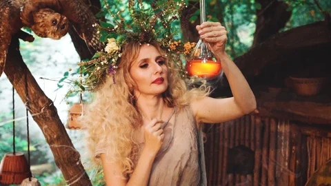 A mysterious laboratory of guard of nature, wise woman with wreath Stock Footage 112744199