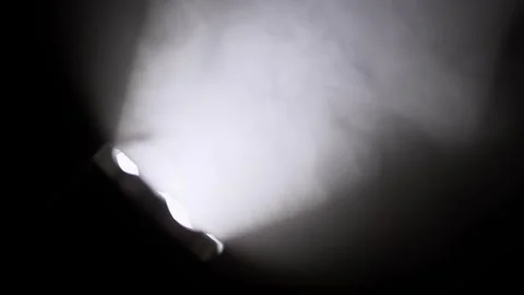 Mysterious Light Beam Cutting Through Thick Atmospheric Smoke Stock Footage 327556544