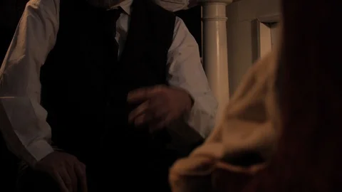 A mysterious man in a dark room - interrogating someone, asking questions Video stock 100476992