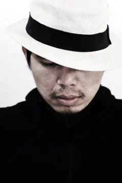 Mysterious man with hat on white Stock Photos