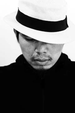 Mysterious man with hat on white 스톡 사진