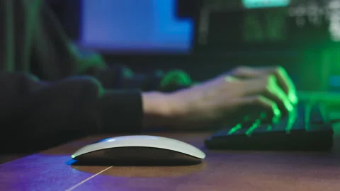 The mysterious man is typing on the keyboard Video stock 185507715