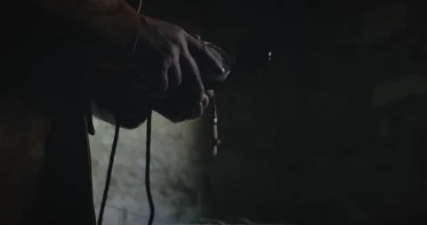 Mysterious Man Using Vintage Engineer Telephone in Dark Suspense Scene Video stock 343810482