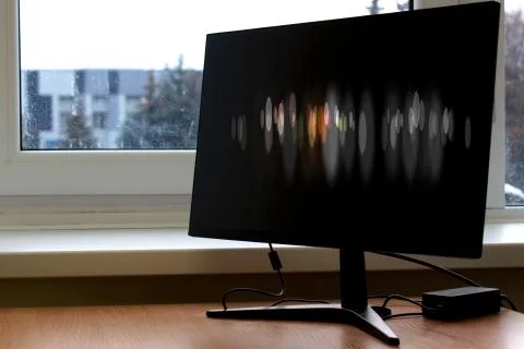 Mysterious optical illusion on computer screen in office desk Stock Photos