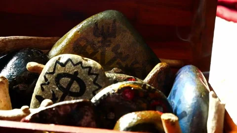 Mysterious painted Viking drawing patterned spiritual stones colourful Stock Footage 158932164