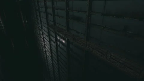 Mysterious shadows cast within an abandoned warehouse at night Stock Footage 331423640