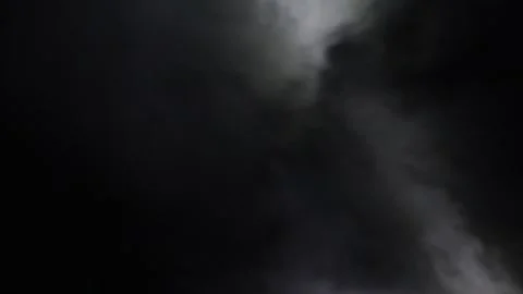 Mysterious shadows dance in the night sky filled with swirling clouds 스톡 동영상 295339094
