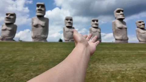 Mysterious Stone Statues Under a Blue Sky Stock Footage 313838264
