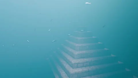 Mysterious Submerged Pyramid with School of Fish – Deep Ocean 3D Animation Stock Footage 334016015