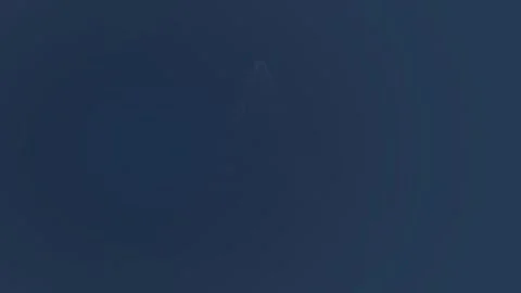 Mysterious triangular object ascends in a twilight sky Stock Footage 325368324