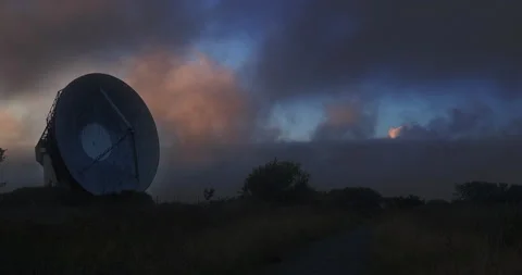 Mysterious vibrant dusk sky behind a parabolic antenna in Goonhilly Stock Footage 159295988