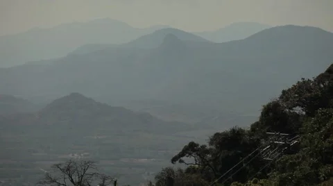 Mysterious view from the mountain to the mountains and the haze tropical valley. Stock Footage 44399984