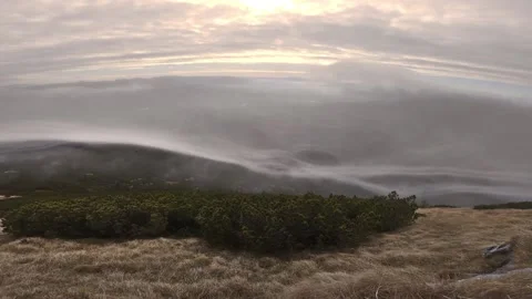 Mystic clouds flows over mountains in sunny autumn nature Stock Footage 144551853