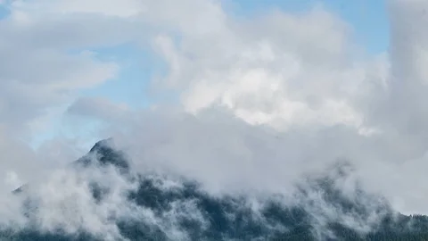 Mystic clouds moving over alpine forest mountains nature Time lapse Stock Footage 115642231